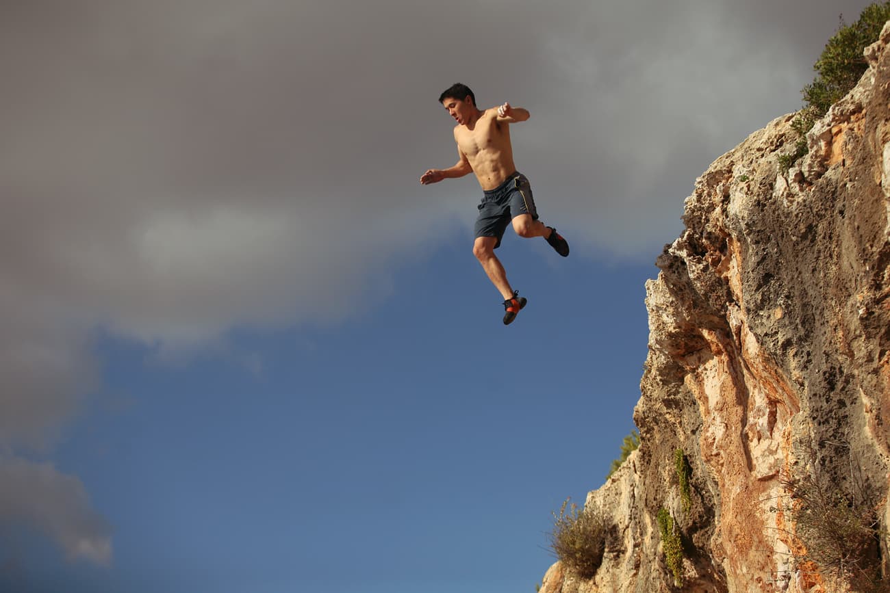 Mallorca deep water solo rock climbing Rockbusters Mike jump